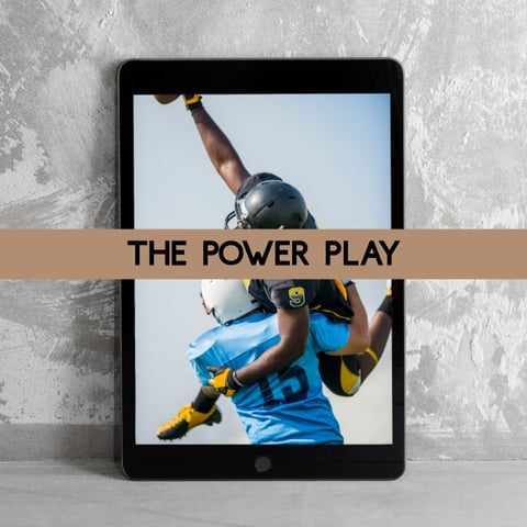 Tablet displaying an athlete in blue and yellow gear with fist raised, with tan banner reading THE POWER PLAY across the screen