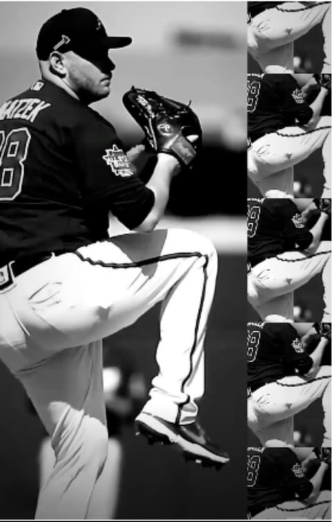 Baseball pitcher in mid-motion wearing number 28 jersey with glove during game, black and white photo